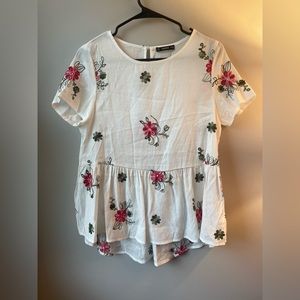 Flowy oversized white shirt sleeve top with pink embroidered flowers